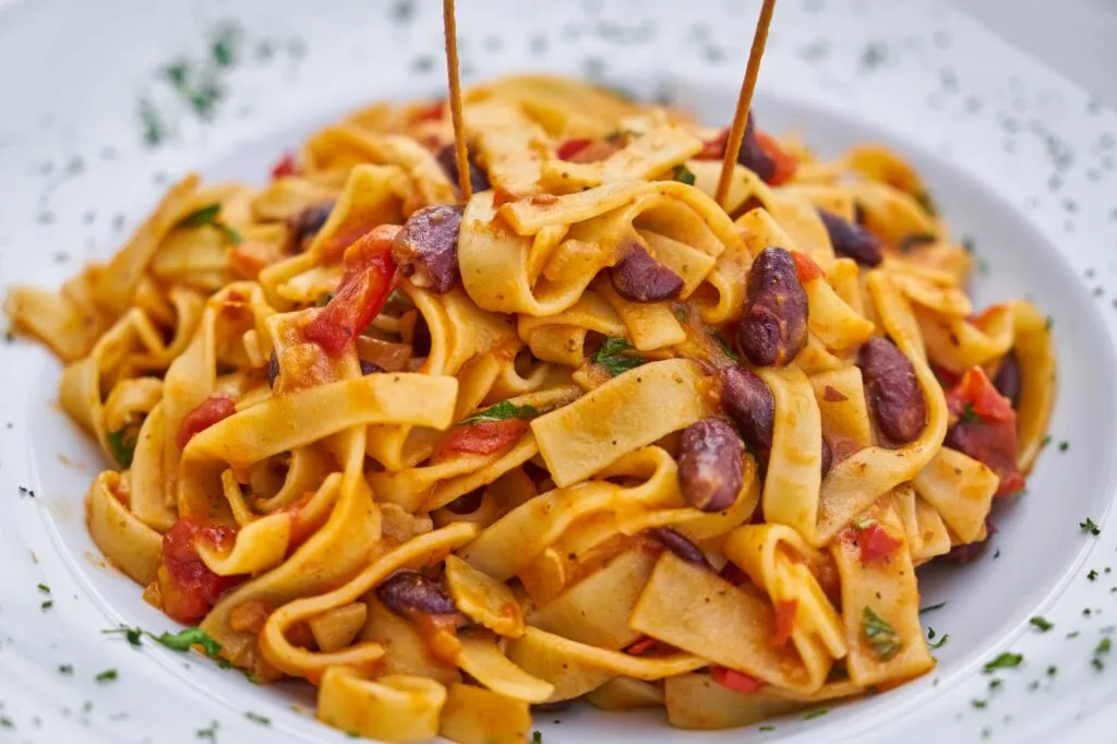 pasta on white plate on focus photo