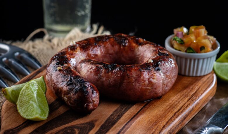 close up photo of a sausage on a wooden surface